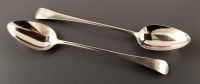 Lot 850 - Two George III gravy spoons, by William Eley &...