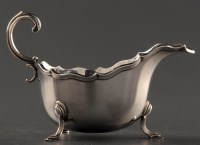 Lot 870 - An Edwardian gravy boat, by Horace Woodward &...