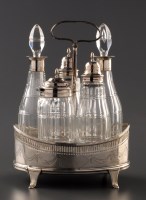 Lot 872 - A George III cruet frame and five bottles, by...