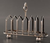 Lot 880 - An Edwardian seven bar toast rack, by Mappin &...