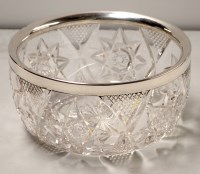 Lot 913 - † A cut glass fruit bowl with silver rim, by A....