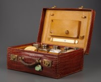 Lot 915 - † A crocodile skin covered dressing case,...