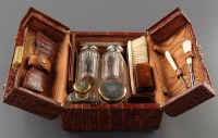 Lot 917 - A George V crocodile skin dressing case,...