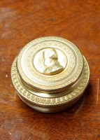 Lot 945 - A French gilt metal snuff box, circular, with...