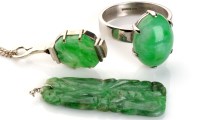 Lot 1007 - A jadeite ring, the single oval cabochon cut...
