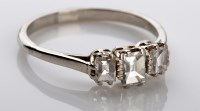 Lot 1035 - A three stone diamond ring, set with three...