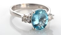 Lot 1040 - An aquamarine and diamond ring, the oval mixed...