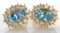 Lot 1043 - A pair of aquamarine and diamond earrings,...