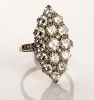 Lot 1063 - A diamond cluster ring, the marquise-shaped...