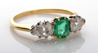 Lot 1071 - An emerald and diamond ring, c.1900, the...