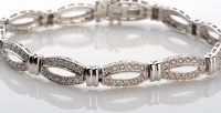 Lot 1073 - A diamond bracelet composed of eleven...