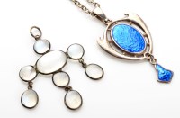 Lot 1099 - Charles Horner: a moonstone pendant, the oval...