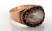 Lot 1111 - An onyx and gold mourning ring, c.1800, the...