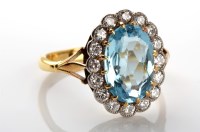 Lot 1116 - An aquamarine and diamond cluster ring, the...