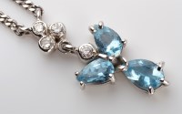 Lot 1118 - An aquamarine and diamond pendant necklace,...