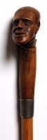 Lot 1187 - A 19th Century carved wood and malacca walking...