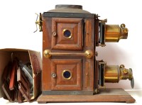 Lot 1196 - A 19th Century biunial magic lantern, the two...