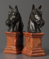 Lot 1210 - A pair of modern bronze horses heads raised on...