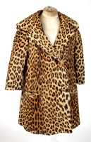 Lot 1267 - An early 20th Century leopard skin coat, three...