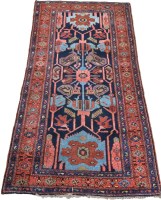 Lot 1273 - A Central Persian rug with stylized floral...