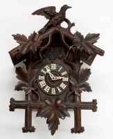 Lot 1284 - A Black Forest carved cuckoo clock, with roman...