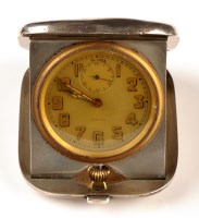 Lot 1285 - A George V silver cased travelling clock, by...