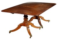 Lot 1344 - † A late Georgian 'plum pudding' mahogany twin...