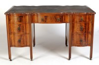 Lot 1349 - † A George III style mahogany desk, the...