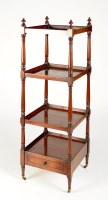 Lot 1352 - † A late Georgian mahogany four-tier...