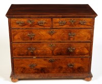 Lot 1361 - † A mid 18th Century walnut chest of two short...