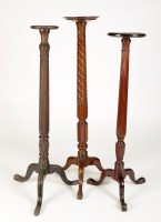 Lot 1363 - † Three circular mahogany torchere stands, two...