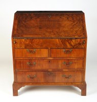 Lot 1378 - † A walnut bureau with a crossbanded fall-flap...