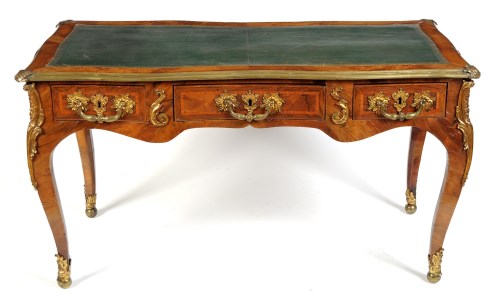 Lot 1406 - A French rosewood and tulip wood Bureau Plat d'...