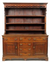 Lot 1417 - A George III oak dresser with associated three-...