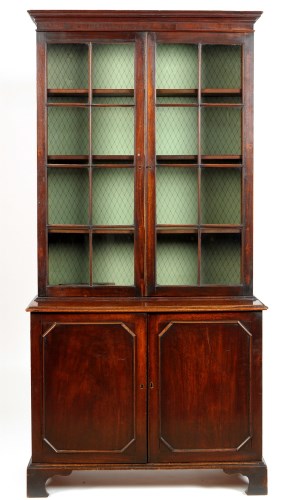 Lot 1425 - A George III mahogany bookcase, the flared...