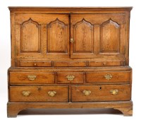 Lot 1443 - An early George III oak cupboard on chest,...