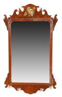 Lot 1445 - A Georgian mahogany wall mirror with carved...