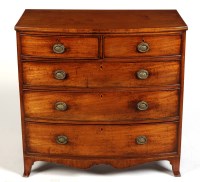 Lot 1446 - A late Georgian mahogany bowfront chest of two...