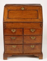 Lot 1452 - An early 18th Century oak bureau, the...