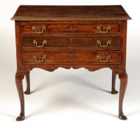 Lot 1455 - An early 18th Century oak lowboy, the top with...