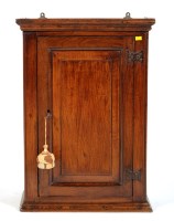 Lot 1467 - An 18th Century oak wall cupboard with a...