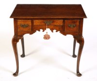 Lot 1471 - A George III oak lowboy, the rectangular top...