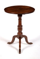 Lot 1474 - An early 19th Century oak tip-up-top...