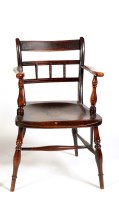 Lot 1492 - A 19th Century East Anglian elm seat armchair...