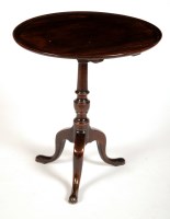 Lot 1496 - A George III circular mahogany tip-up-top...