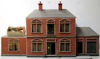 Lot 1546 - An early 20th Century doll's house with two...