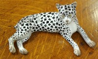 Lot 1556 - A 19th Century Dresden figure of a leopard,...