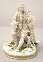 Lot 1559 - A Continental porcelain figure of a seated...