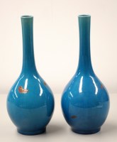 Lot 1560 - A pair of Oriental blue glaze soli fleur vases...