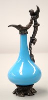 Lot 1580 - A miniature blue glass ewer with metal mount...